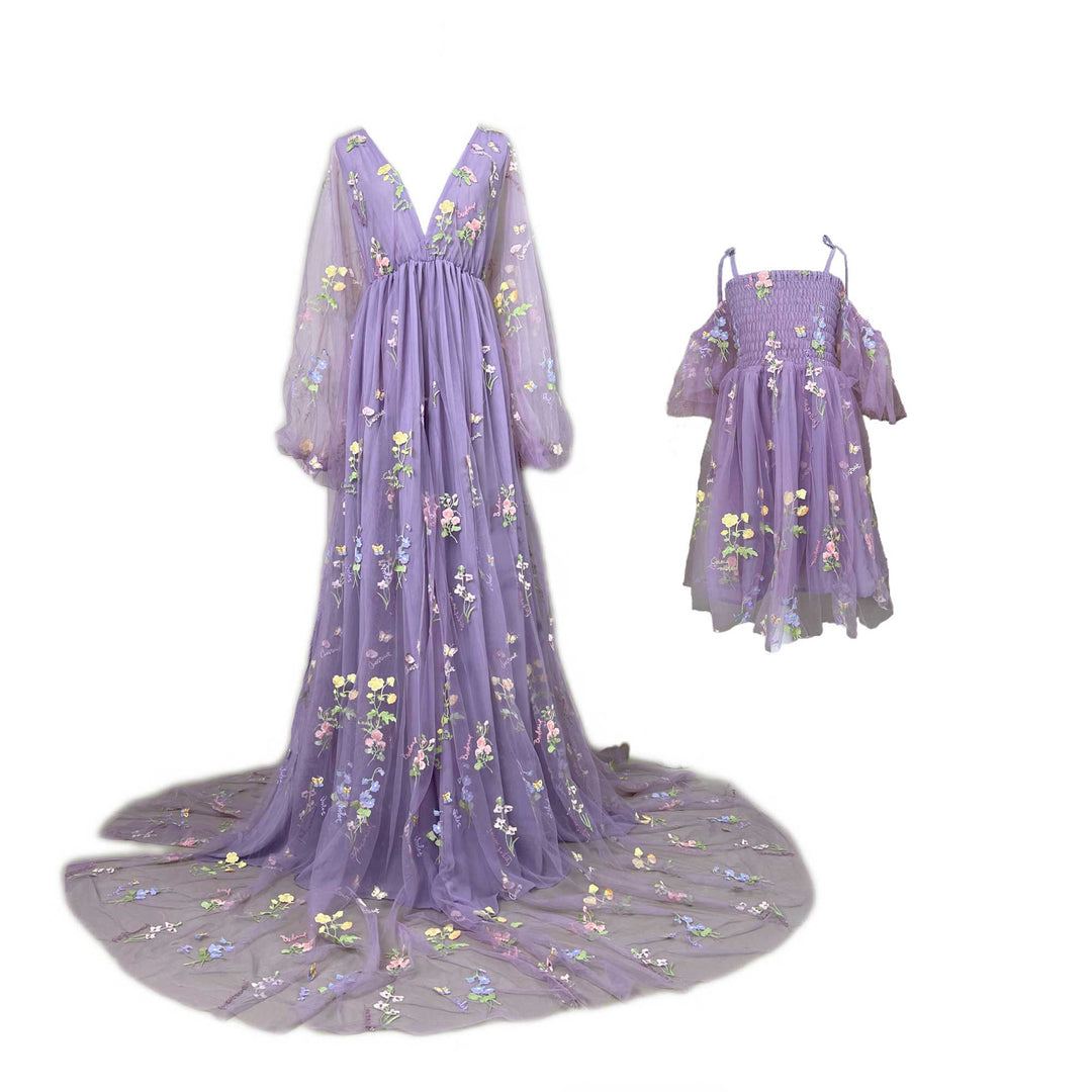 An Apate Mon and little girl's purple butterfly floral embroidered dresses on mannequin.