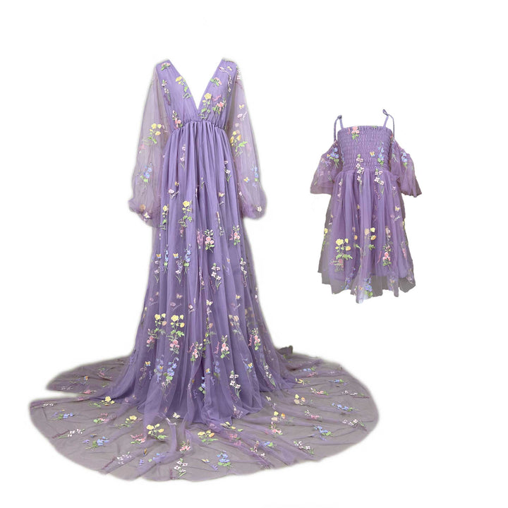 An Apate Mon and little girl's purple butterfly floral embroidered dresses on mannequin.