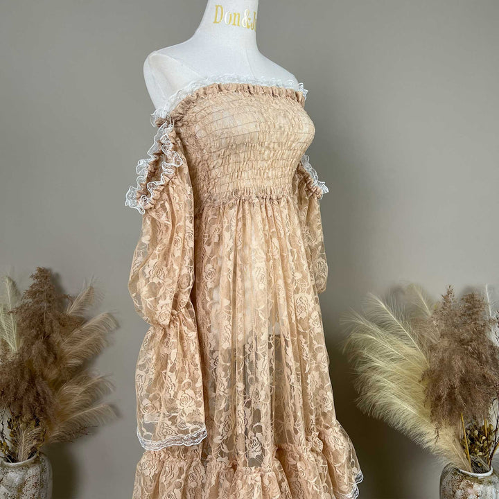 A Selene khaki lace off-shoulder unlined is displayed on a mannequin, featuring a shirred bodice, tiered ruffled sleeves, and a multi-layered cake skirt.