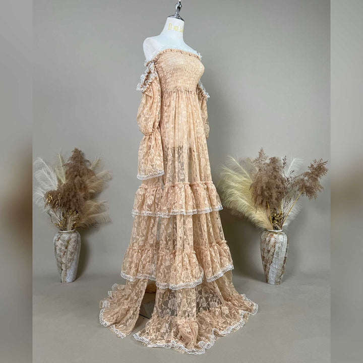 A Selene khaki lace off-shoulder unlined is displayed on a mannequin, featuring a shirred bodice, tiered ruffled sleeves, and a multi-layered cake skirt.