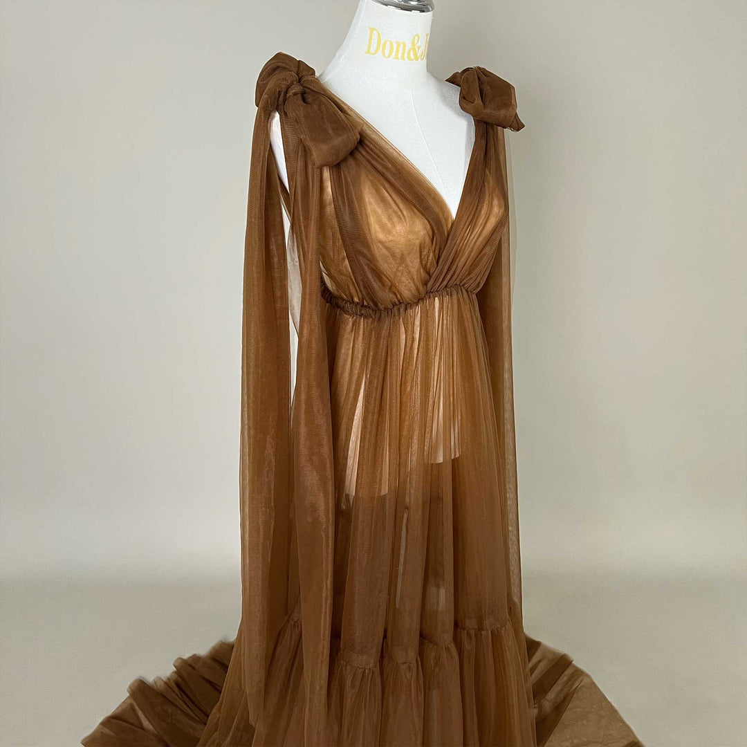 Close up of upper bodice details of the Acaste gown, showing the V-neckline, shoulder bow knots, and elastic waistband construction.