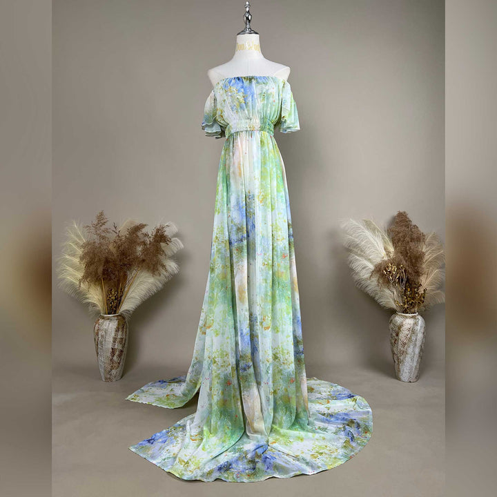 A mannequin displays a Achlys watercolor floral print maternity photography dress.
