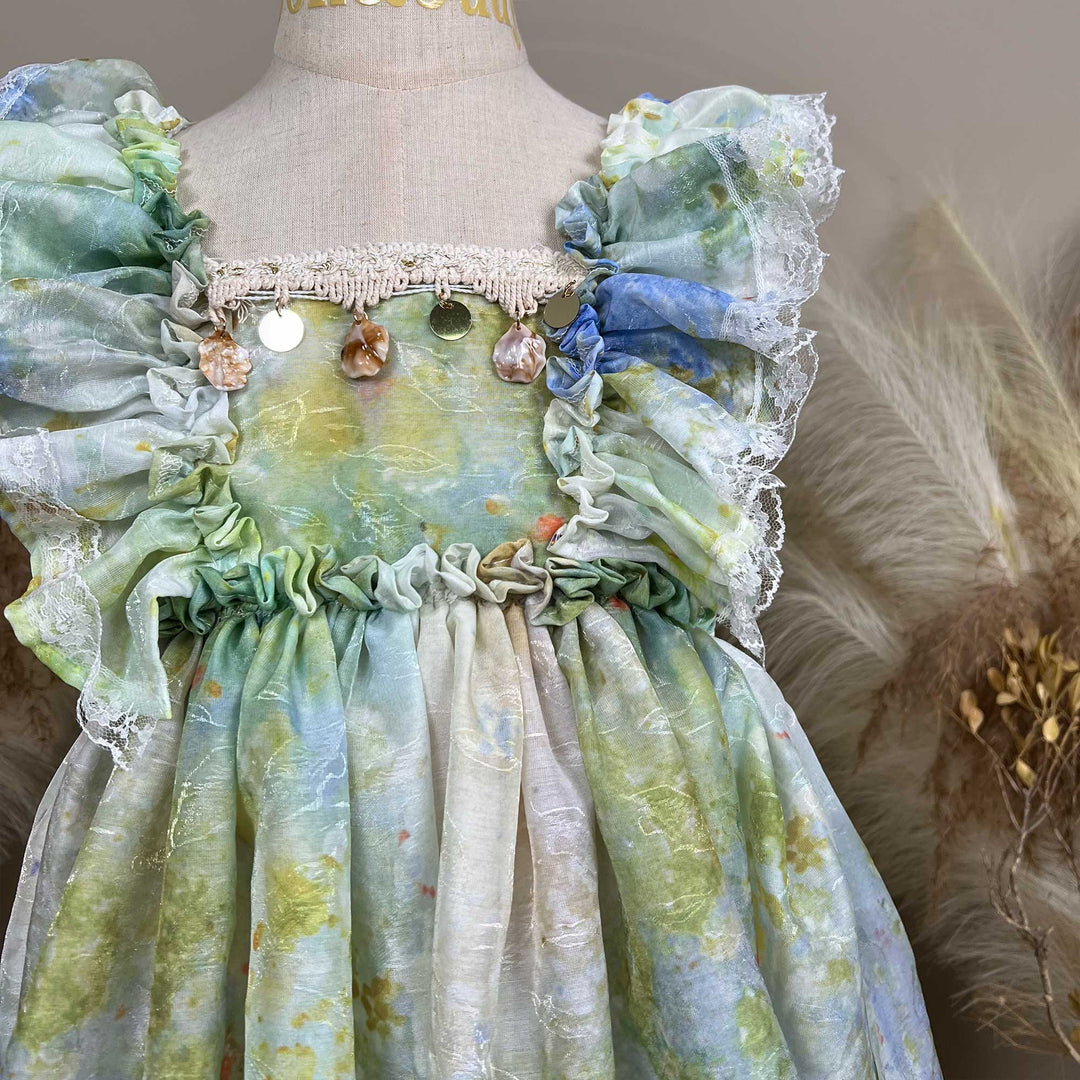 Close up of A mannequin displays an Adrasteia 3D floral lace trim dress.