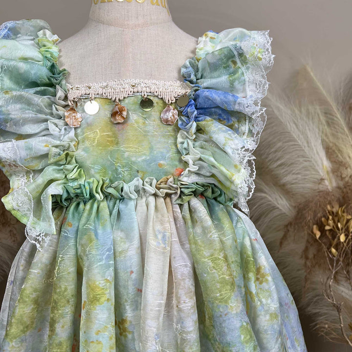Close up of A mannequin displays an Adrasteia 3D floral lace trim dress.