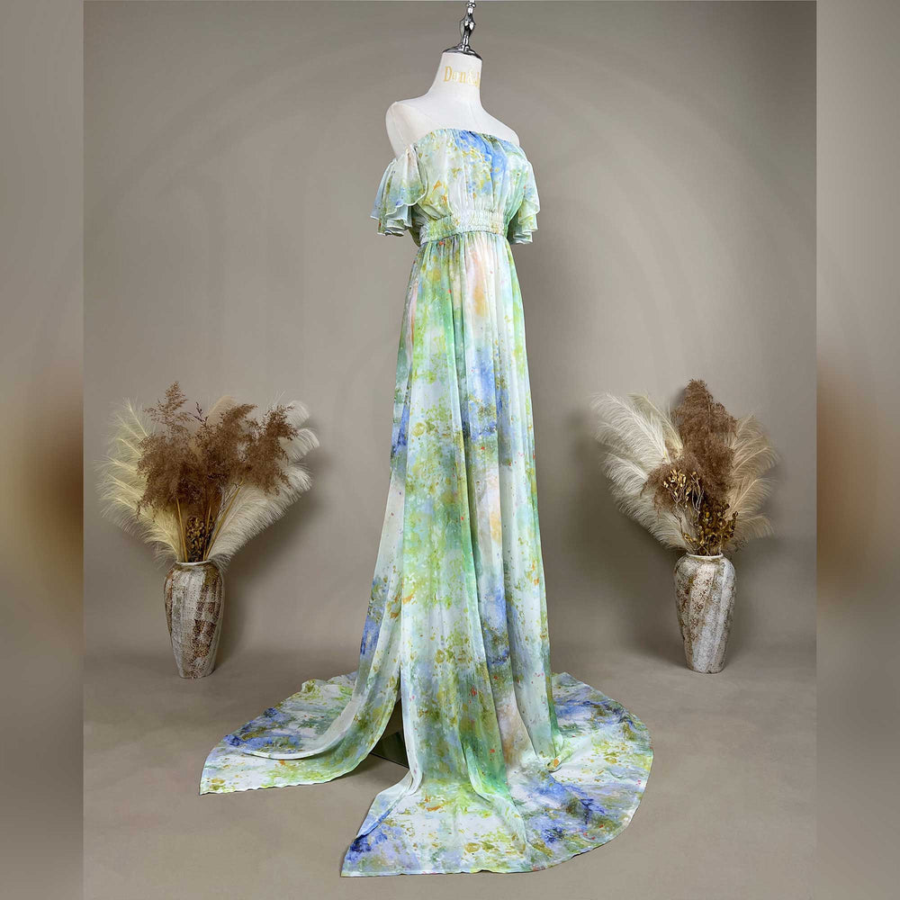 A mannequin wearing an Aglaea tie dye chiffon printed long dress stands in the center. 