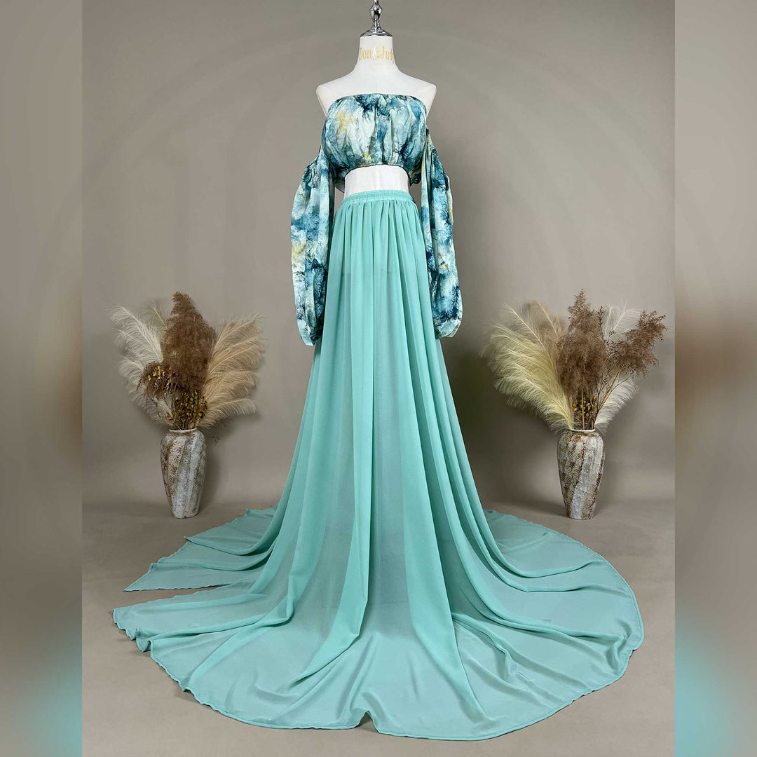 A Alala tie dye printed off shoulder top and a mint skirt with a train are displayed on a mannequin. 