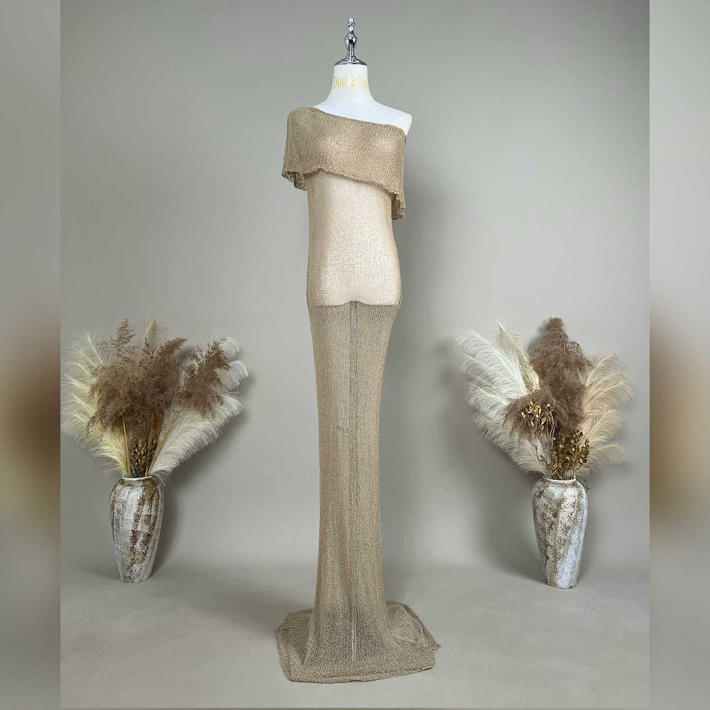 An Aletheia  camel sparkling off-shoulder gown is displayed on a mannequin.