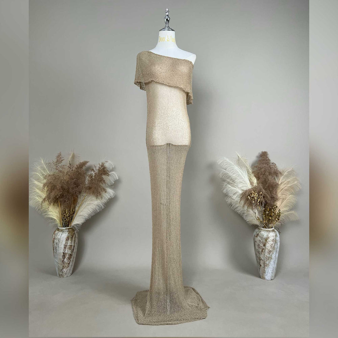 An Aletheia  camel sparkling off-shoulder gown is displayed on a mannequin.