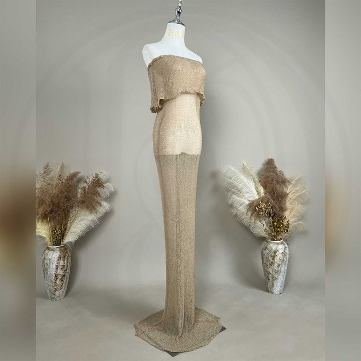 A side view of an Aletheia  camel off-shoulder gown is displayed on a mannequin.