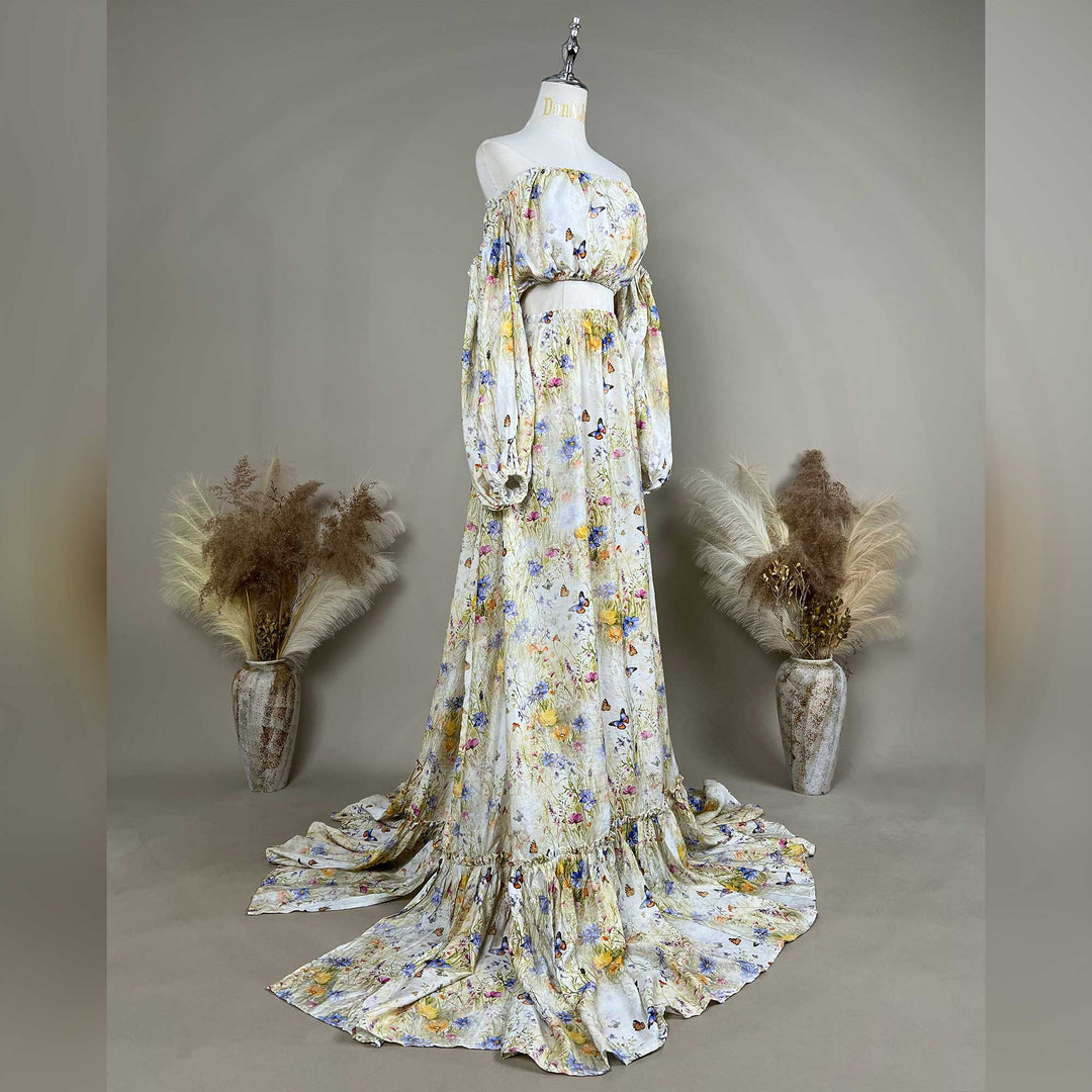 A side view of an Aphaea floral and butterfly print off-shoulder two-piece is displayed on a mannequin.