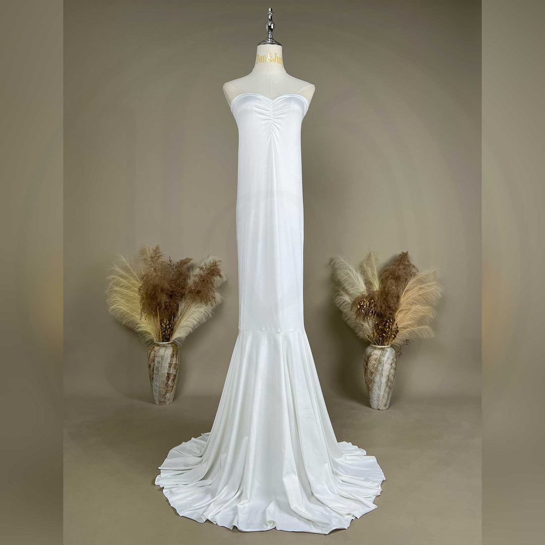 An Astraea satin maxi dress is displayed on a mannequin.