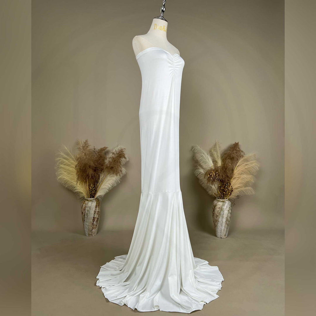 An Astraea satin maxi dress is displayed on a mannequin.
