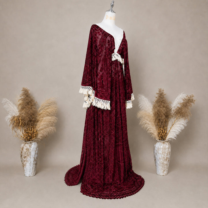 A Red wine,A bacche dress with a velvet is displayed on a mannequin.