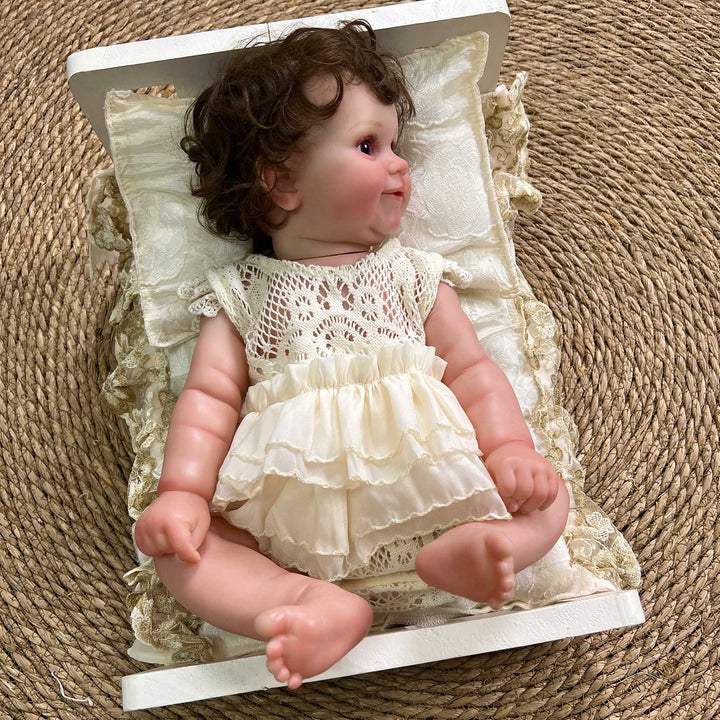 A 2-piece set featuring a newborn blanket and pillow with beige floral print and lace trim for newborn photography.