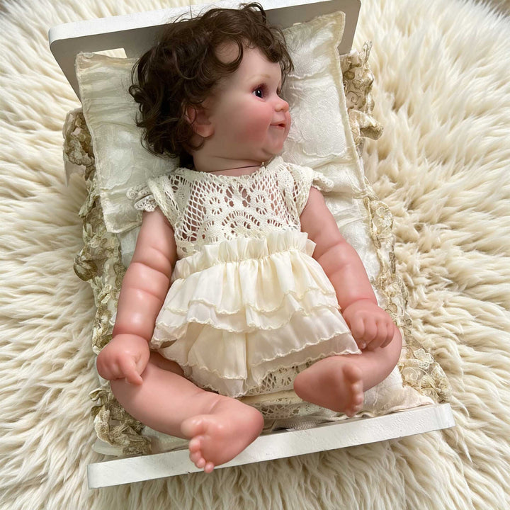 The doll wears a beige crocheted lace top with a double-layer ruffled skirt romper.