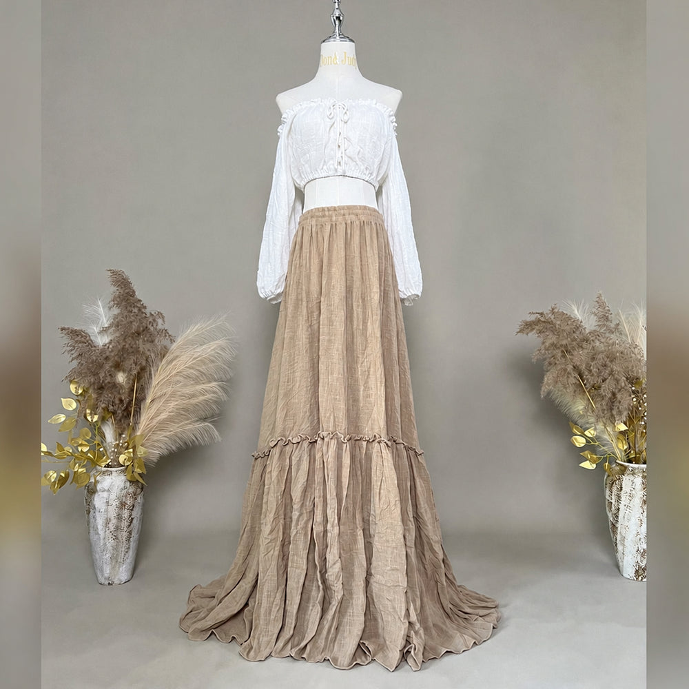 Brigid ivory off-shoulder top and khaki ruffled skirt are displayed on a mannequin.