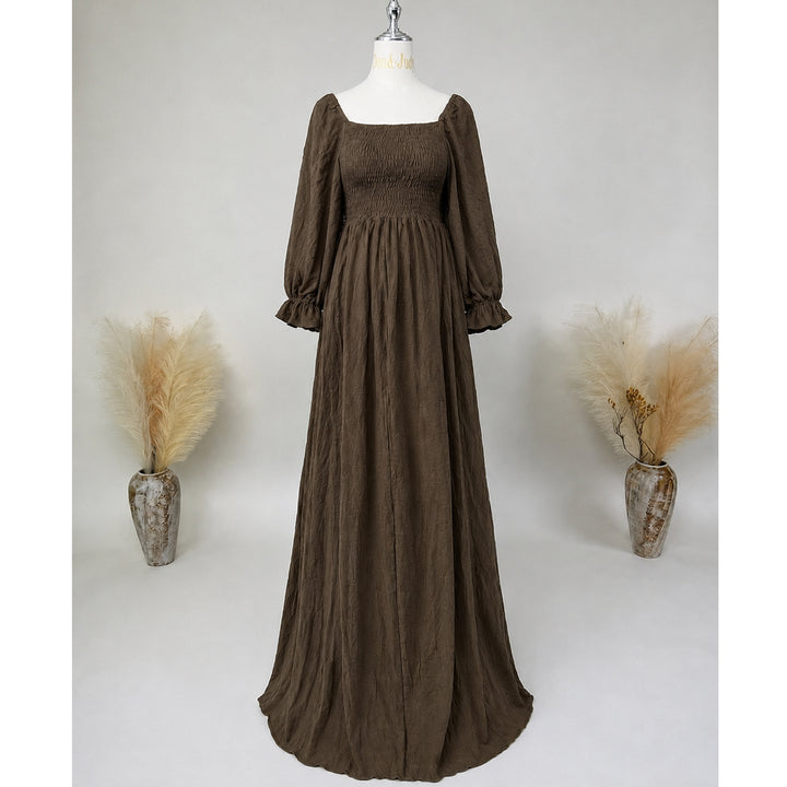 A khaki square-neck puff-sleeve ruched gown is displayed on a mannequin.