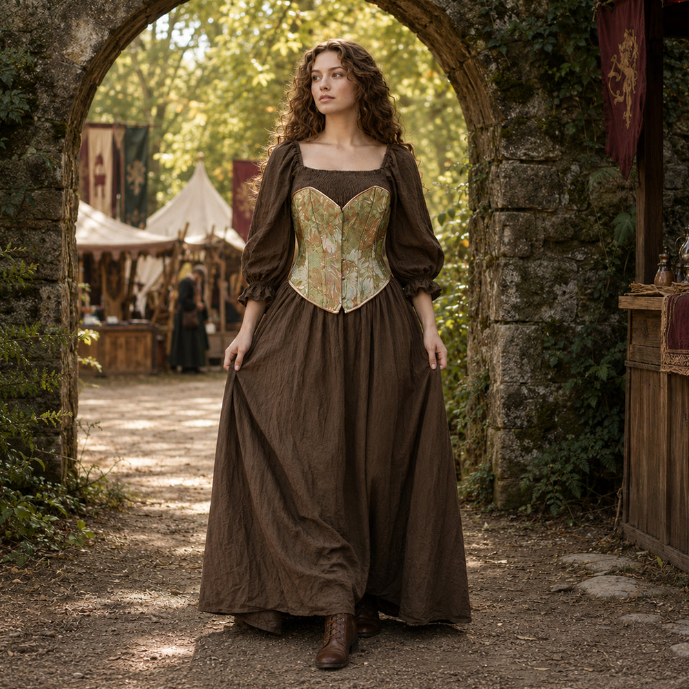 Full-length view of a woman wearing the Brimo olive dress with a vintage floral corset at a Renaissance festival