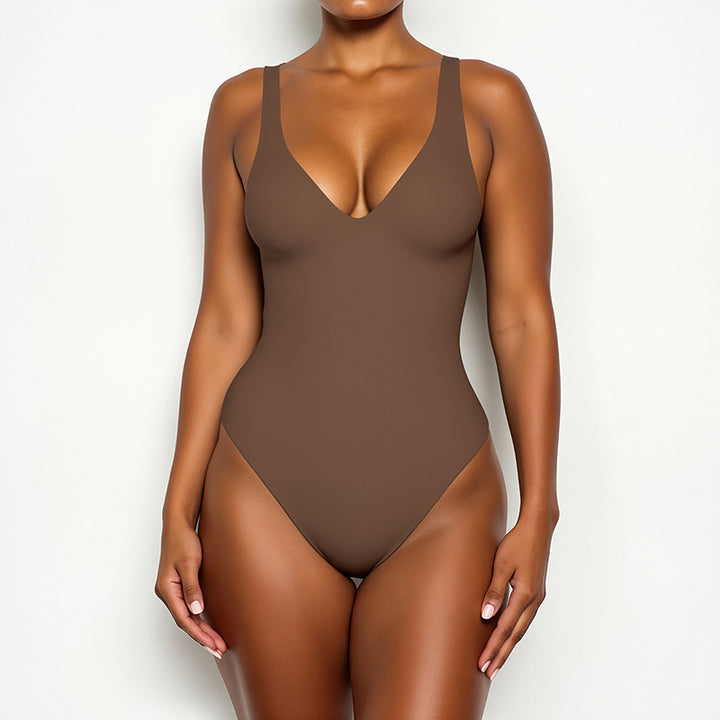 A female model wearing a brown Callirrhoe swimsuit is shown.