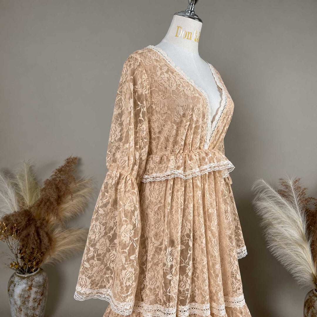 A close-up of the Clito khaki lace dress bodice, showing the V neckline, waist ruffle and sleeve with a tie.