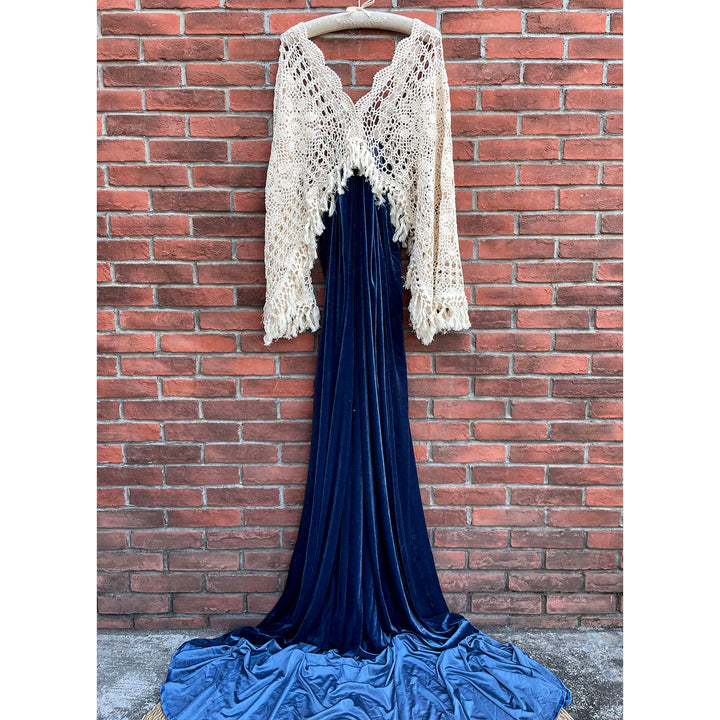 A mannequin wears Edwina KO-7 slip dress and a beige crochet cardigan. 