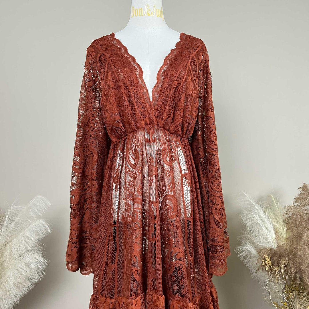 A terracotta lace robe displayed on a mannequin. The garment features a deep V-neckline with scalloped edges, long sleeves, and an open front design that reveals the midsection area.