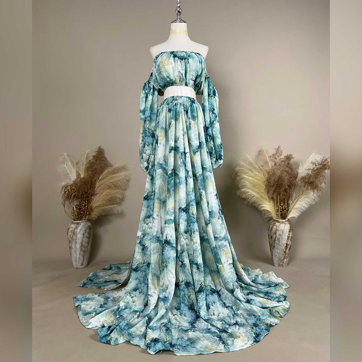 A Hestia tie dye print off-shoulder top and long skirt with a train are displayed on a mannequin. 