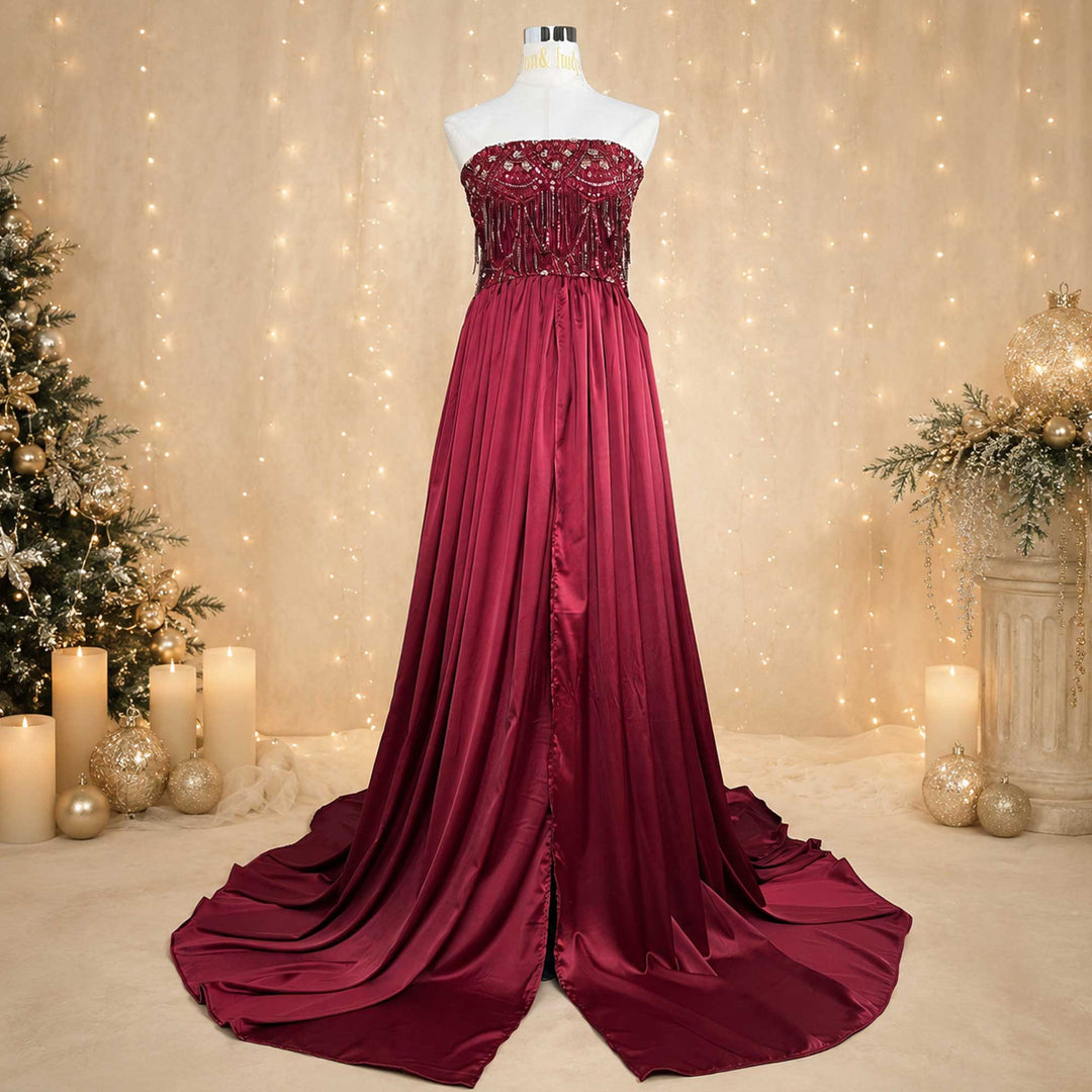 A red Luna strapless gown, featuring ruffled designs at the waist  displayed on a mannequin.