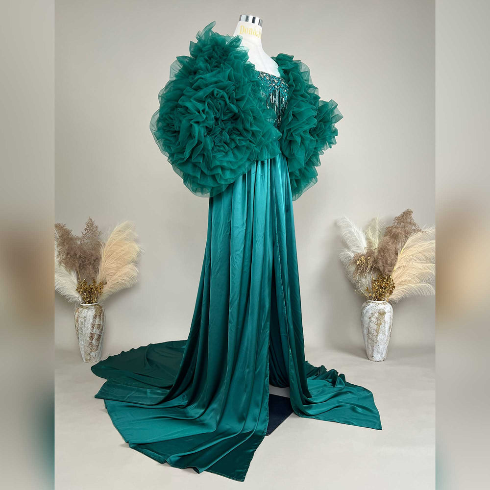 A green Luna gown and shawl are displayed on a mannequin against a white background. 
