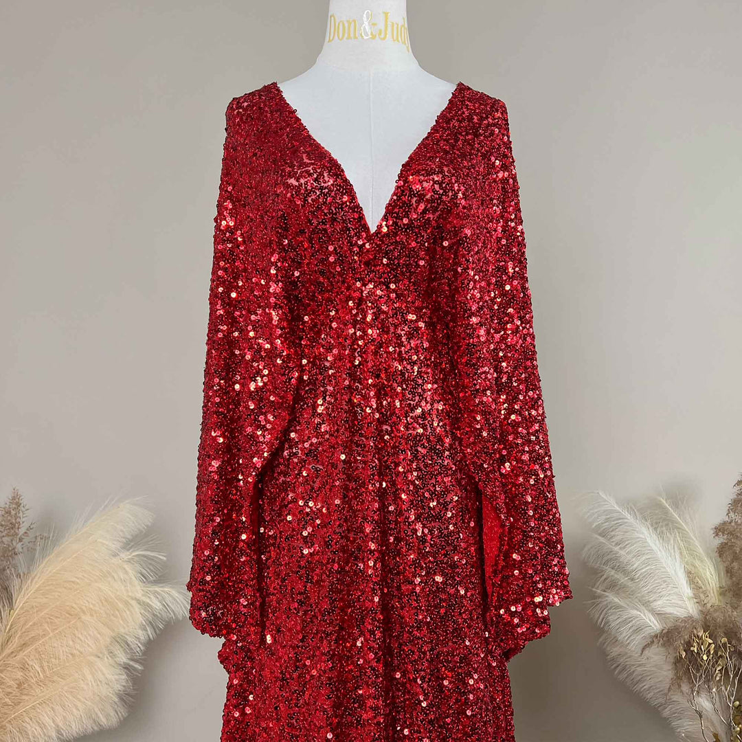 A red Mara dress sequined gown, featuring a V-neck and flared sleeves displayed on a mannequin.