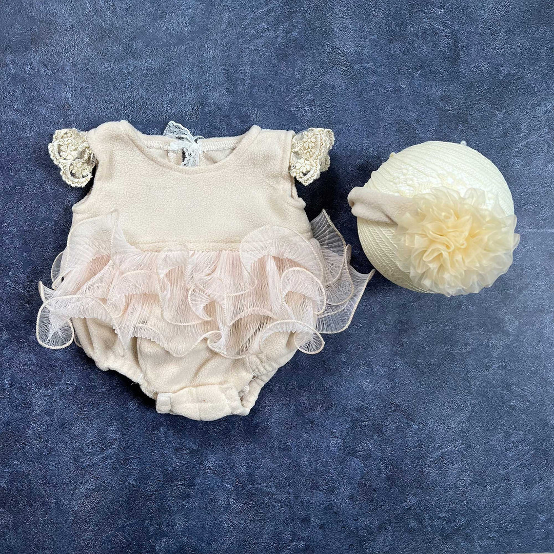 A polar fleece organza ruffled trim romper and headband set.
