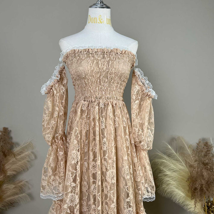 This khaki Selene lace gown is displayed on a mannequin, featuring white lace trim on the sleeves and skirt. 