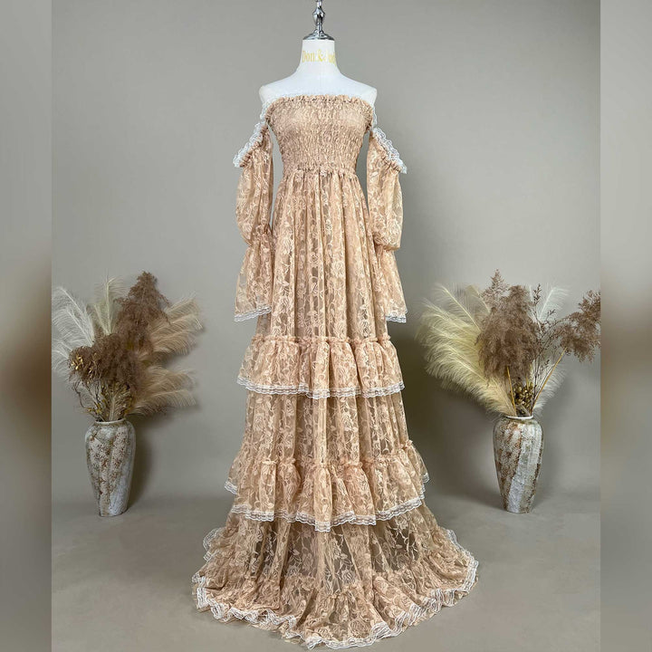 This khaki Selene lace gown is displayed on a mannequin, featuring white lace trim on the sleeves and skirt. 