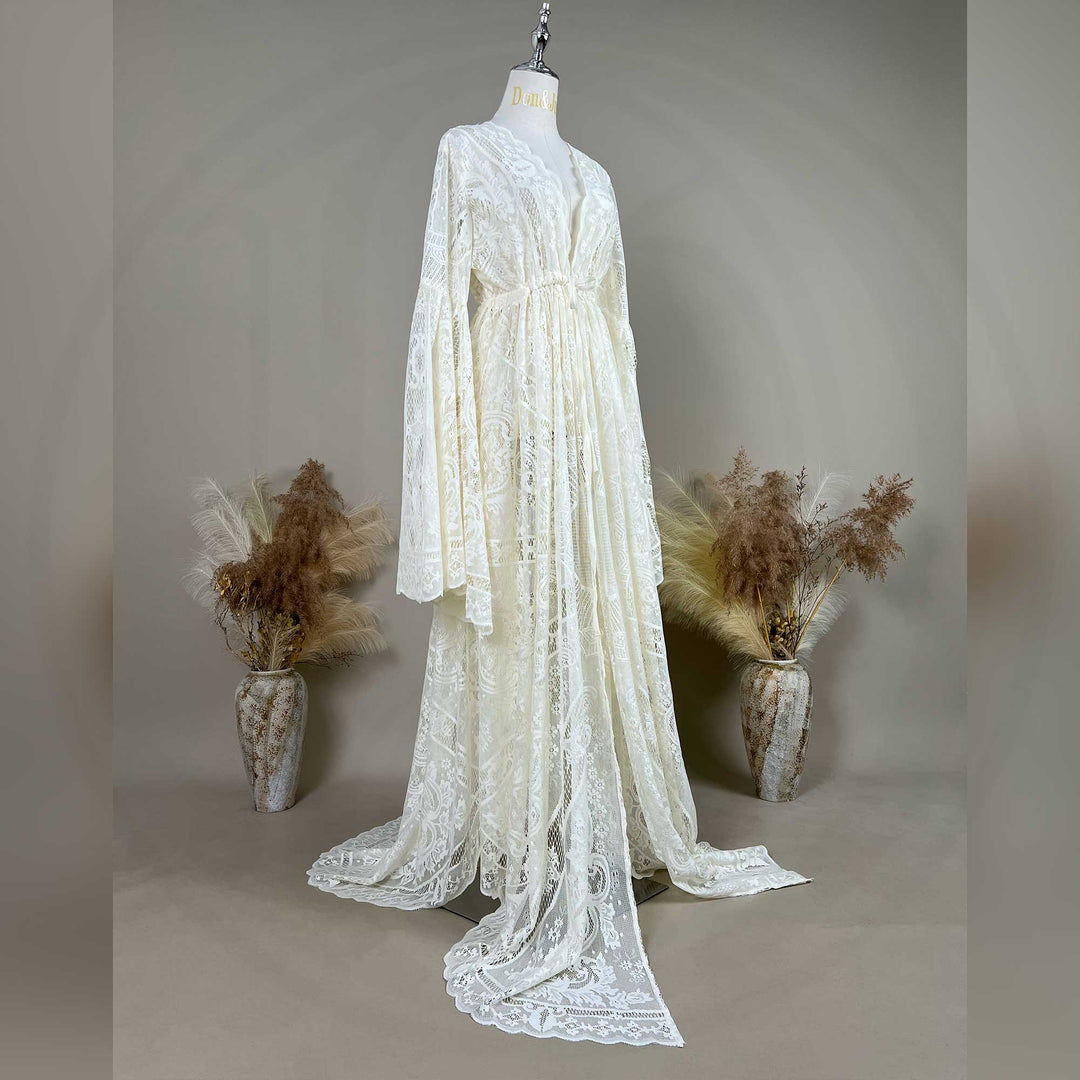 A beige lace ,Zephyra dress with long bell sleeves and a V-neckline, displayed on a mannequin. 
